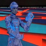 Bild från filmen Tron. Mänsklig skådespelare med datoranimerade konturer mot stiliserad bakgrund.